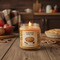 Hot baked apple pie scented homemade candle in a glass jar